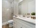 Modern bathroom with white vanity and marble shower at 13707 Begonia Cir, Port Charlotte, FL 33981