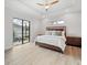 Main bedroom with king-size bed, sliding doors to the pool area and ceiling fan at 13707 Begonia Cir, Port Charlotte, FL 33981