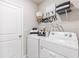 Laundry room with washer, dryer, and shelving at 1437 Powell Valley Dr, Port Charlotte, FL 33953