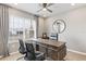 Home office with L-shaped desk, two chairs, and large window at 1437 Powell Valley Dr, Port Charlotte, FL 33953