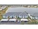 Aerial view of waterfront condo building with parking and lake at 1501 San Cristobal Ave # 1205, Punta Gorda, FL 33983