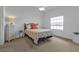 Bedroom with double bed, coral bedding, and ceiling fan at 1501 San Cristobal Ave # 1205, Punta Gorda, FL 33983