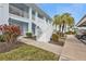 Light blue building with white stairs and landscaping at 1501 San Cristobal Ave # 1205, Punta Gorda, FL 33983