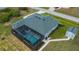 Aerial view showing home, pool, and canal-front lot at 15308 Acorn Cir, Port Charlotte, FL 33981