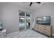 Bedroom with pool view, large TV, and neutral decor at 15308 Acorn Cir, Port Charlotte, FL 33981