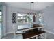 Bright dining room with table and bench seating near the pool at 15308 Acorn Cir, Port Charlotte, FL 33981