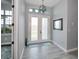 Bright entryway with double doors and tile floor at 15308 Acorn Cir, Port Charlotte, FL 33981