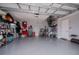 Spacious garage with epoxy flooring, ample storage, and well-organized shelving at 15308 Acorn Cir, Port Charlotte, FL 33981