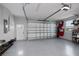 Spacious garage with epoxy floor and ample storage at 15308 Acorn Cir, Port Charlotte, FL 33981