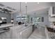 Open concept kitchen with island, granite countertops, and stainless steel appliances at 15308 Acorn Cir, Port Charlotte, FL 33981