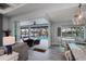 View of the pool from the kitchen with sliding glass doors at 15308 Acorn Cir, Port Charlotte, FL 33981
