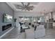 Open living area with sectional sofa and kitchen view at 15308 Acorn Cir, Port Charlotte, FL 33981