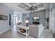 Bright living room with gray walls, electric fireplace, and hardwood floors at 15308 Acorn Cir, Port Charlotte, FL 33981