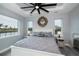 Main bedroom with water views and a ceiling fan at 15308 Acorn Cir, Port Charlotte, FL 33981