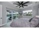Main bedroom with water views, private pool access, and large windows at 15308 Acorn Cir, Port Charlotte, FL 33981