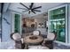 Covered patio with seating area and view of the pool at 15308 Acorn Cir, Port Charlotte, FL 33981