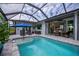 Relaxing pool and lanai with seating area at 15308 Acorn Cir, Port Charlotte, FL 33981