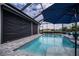 Relaxing pool and lanai with seating area at 15308 Acorn Cir, Port Charlotte, FL 33981