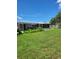 Spacious backyard with screened patio and fenced yard at 158 Concord Ne Dr, Port Charlotte, FL 33952