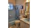 Clean bathroom with light blue tile and updated vanity at 158 Concord Ne Dr, Port Charlotte, FL 33952