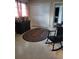 Cozy bedroom featuring a dresser, rocking chair, and rug at 158 Concord Ne Dr, Port Charlotte, FL 33952