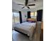 Spacious bedroom with a large bed and sliding glass doors at 158 Concord Ne Dr, Port Charlotte, FL 33952