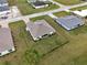 Aerial view of house with fenced backyard at 16039 Quinta Dr, Punta Gorda, FL 33955