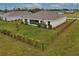 Aerial view of a fenced backyard with young landscaping at 16039 Quinta Dr, Punta Gorda, FL 33955