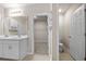 Bathroom with double vanity, white cabinets, and toilet at 16039 Quinta Dr, Punta Gorda, FL 33955