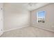 Simple bedroom with carpeted floor and window at 16039 Quinta Dr, Punta Gorda, FL 33955