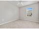 Spacious bedroom with carpeted floor and window at 16039 Quinta Dr, Punta Gorda, FL 33955