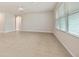 Spacious living room with tile flooring and neutral wall colors at 16039 Quinta Dr, Punta Gorda, FL 33955