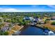 Aerial view showcasing waterfront property, private dock, and boat at 17220 Horizon Ln, Port Charlotte, FL 33948