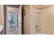 Bathroom with a shower and access to the backyard at 17220 Horizon Ln, Port Charlotte, FL 33948