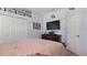 Spacious bedroom with a large TV, dresser, and built in shelves at 17220 Horizon Ln, Port Charlotte, FL 33948