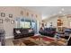 Relaxing living room featuring leather furniture and a large rug at 17220 Horizon Ln, Port Charlotte, FL 33948