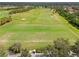 Aerial view of golf course driving range at 1906 Creek Nine Dr, North Port, FL 34291