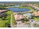 Aerial view of a luxury home in a golf course community at 1906 Creek Nine Dr, North Port, FL 34291