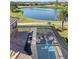 Aerial view showing the home's pool and spa with screened enclosure at 1906 Creek Nine Dr, North Port, FL 34291