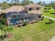 Aerial view highlighting the home's pool and backyard oasis at 1906 Creek Nine Dr, North Port, FL 34291