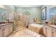 Elegant bathroom with double vanity, soaking tub, and shower at 1906 Creek Nine Dr, North Port, FL 34291