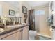 Clean bathroom with shower/tub combo and updated vanity at 1906 Creek Nine Dr, North Port, FL 34291