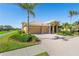 Exterior view of a two-car garage and front entrance at 1906 Creek Nine Dr, North Port, FL 34291