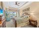 Large main bedroom with water views and luxurious bedding at 1906 Creek Nine Dr, North Port, FL 34291