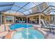 Inviting pool with spa and fountain feature at 1906 Creek Nine Dr, North Port, FL 34291