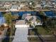 Aerial view of single Gathering home with canal access and lush landscaping at 193 Beeney Se Rd, Port Charlotte, FL 33952