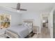 Guest bedroom with ceiling fan and window at 193 Beeney Se Rd, Port Charlotte, FL 33952