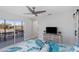 Main bedroom with water views and sliding glass doors to balcony at 193 Beeney Se Rd, Port Charlotte, FL 33952