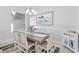 Coastal-themed dining room with grey table and chairs at 193 Beeney Se Rd, Port Charlotte, FL 33952