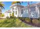 House exterior showcasing landscaping and a columned entryway at 193 Beeney Se Rd, Port Charlotte, FL 33952